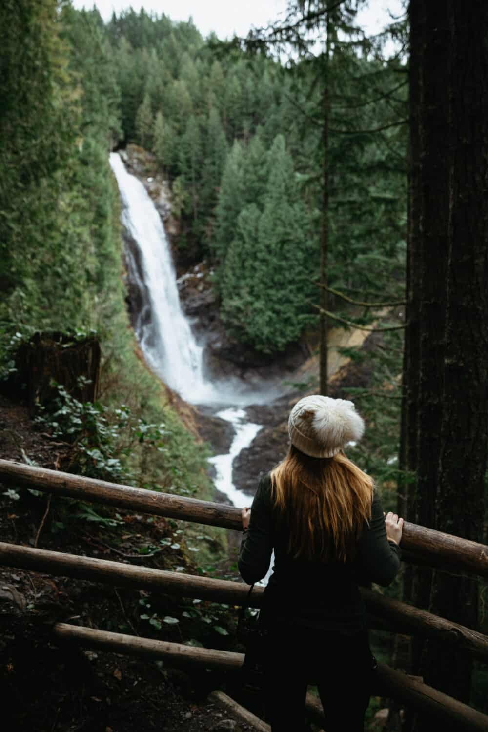 Emily Mandagie standing at Lower Viewpoint, Wallace Falls State Park - Washington - TheMandagies.com