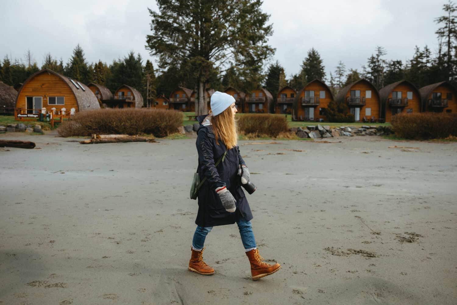 Emily Mandagie walking on beaches in Tofino, BC