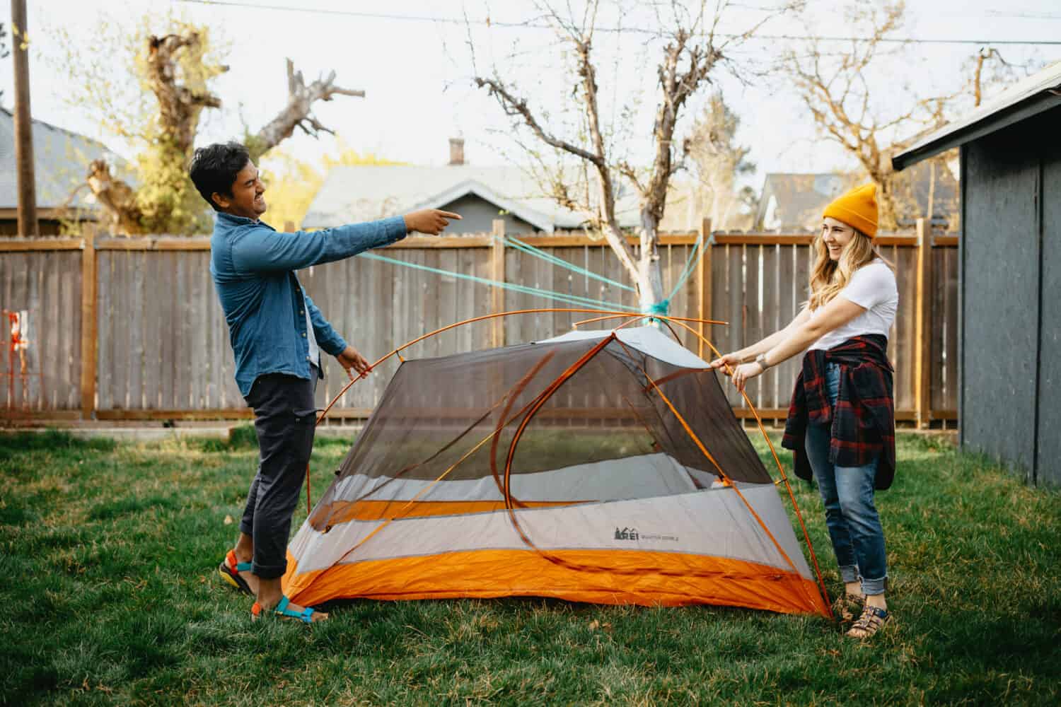 Berty and Emily Mandagie setting up backyard tent