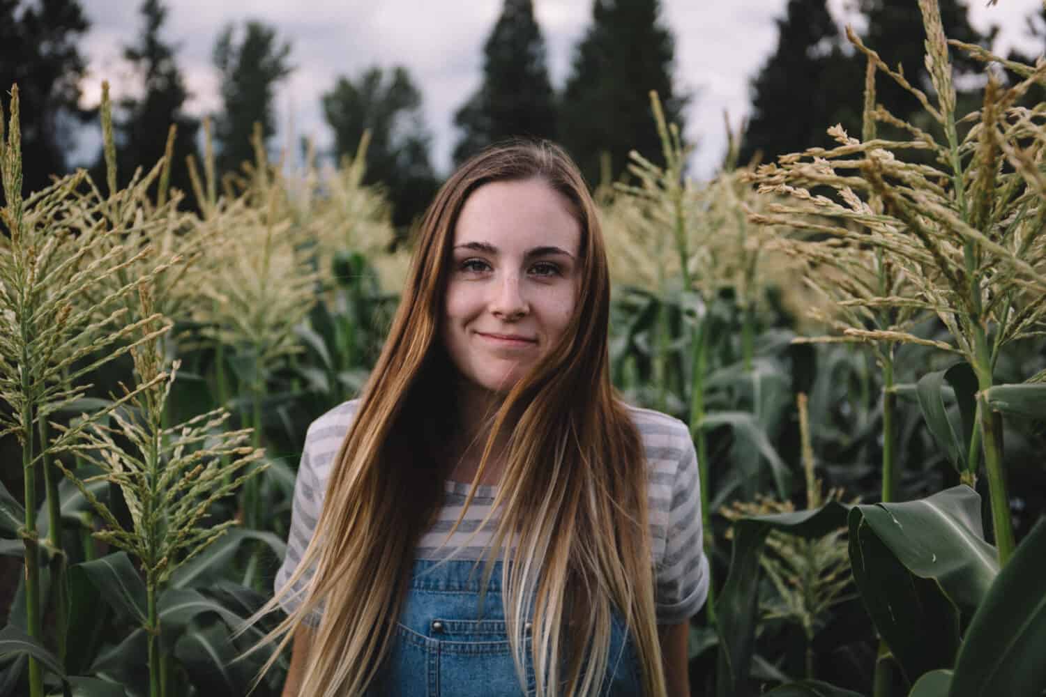 Emily Mandagie standing in corn field