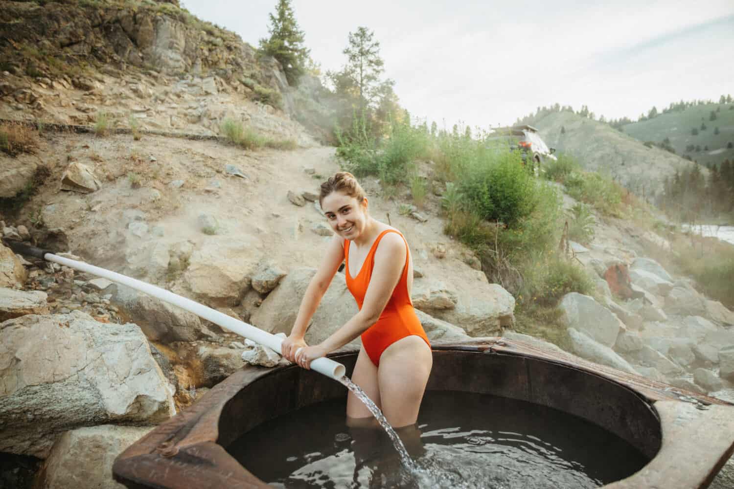 Emily Mandagie filling up the pool with spring water