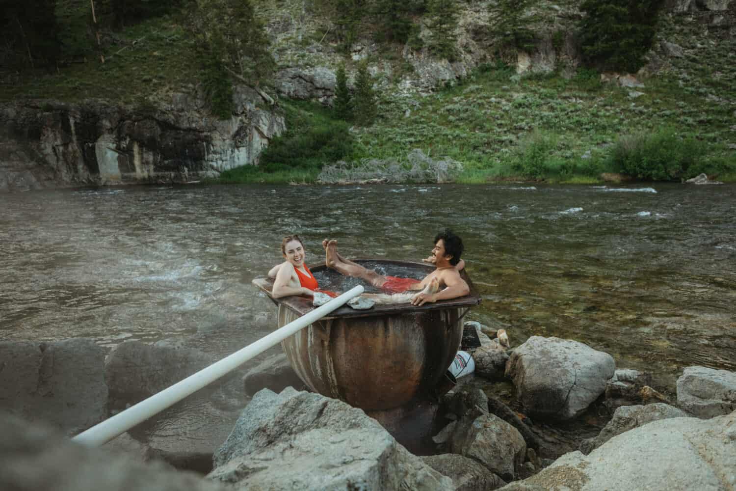 Berty and Emily Mandagie sharing small Idaho hot springs