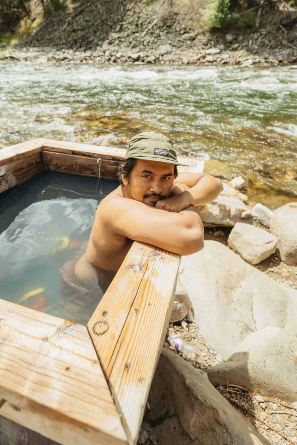 Berty Mandagie soaking in hot springs