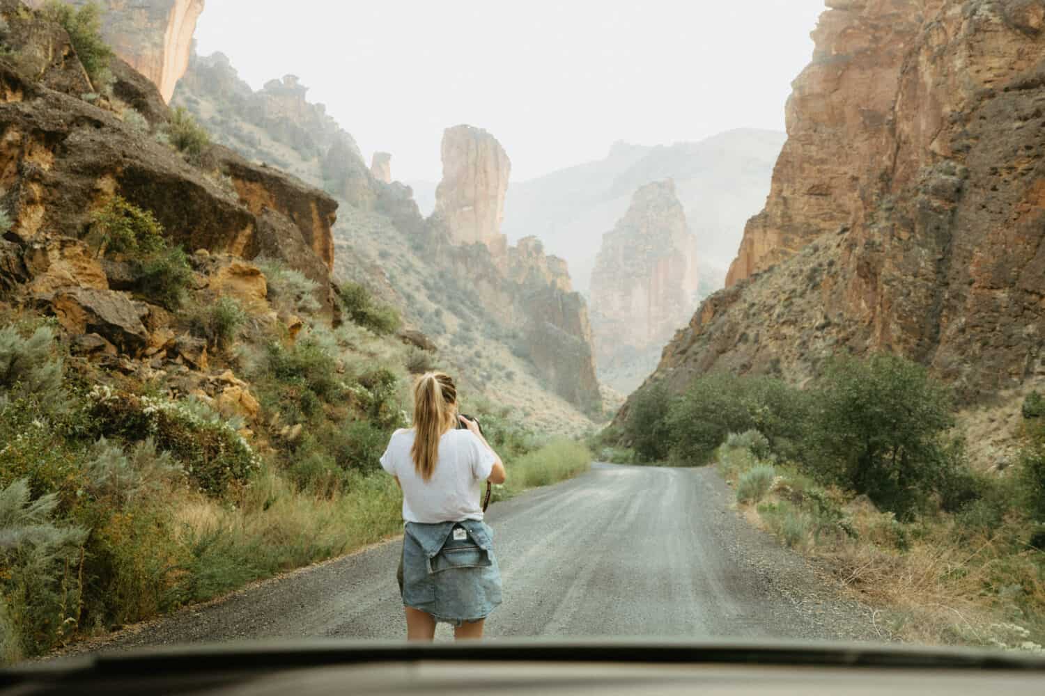 Emily taking photos in Leslie Gulch on road trip in Eastern Oregon