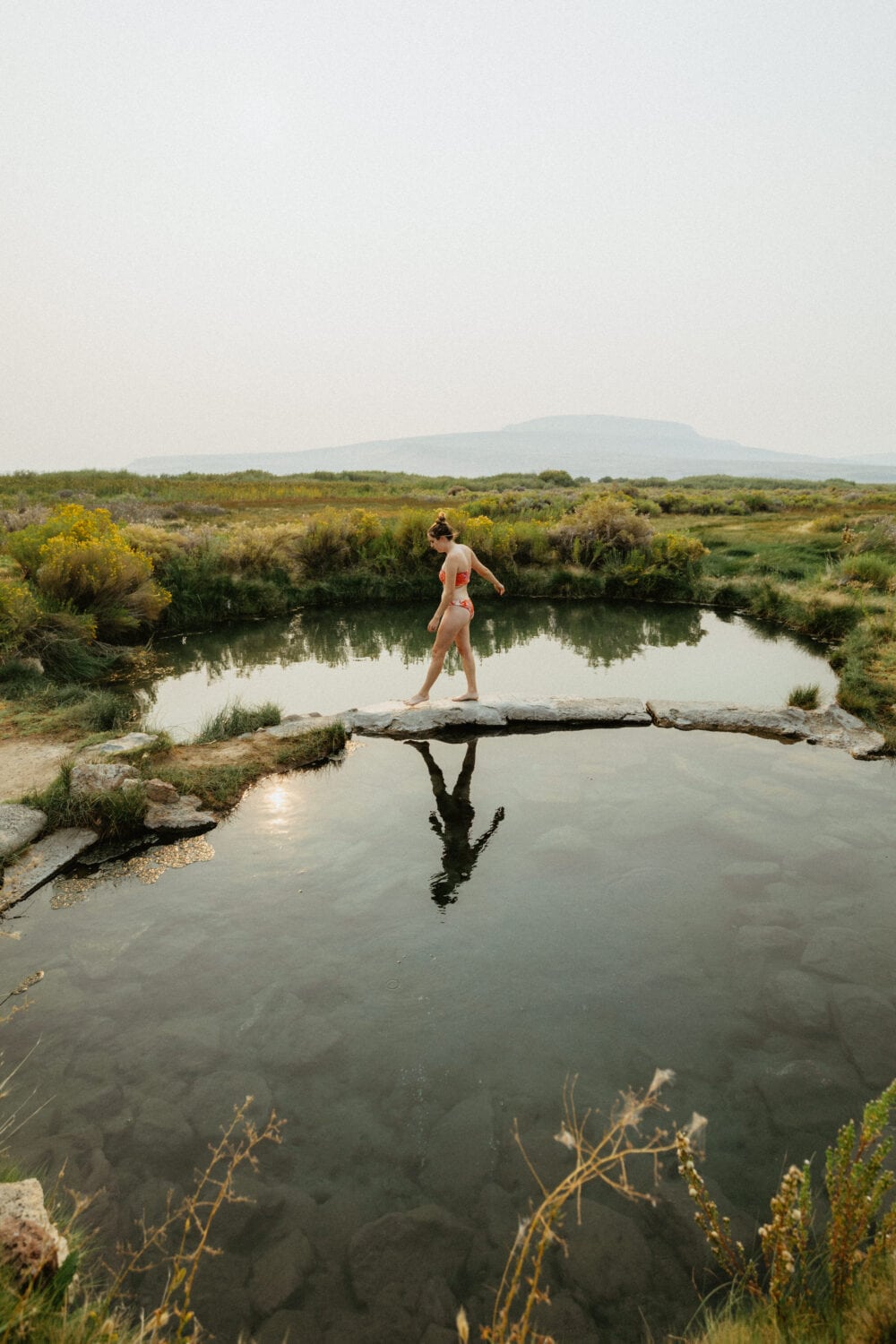 Emily Mandagie at Willow Creek Hot Springs during sunset