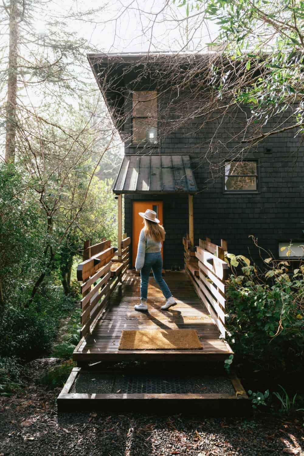 Emily Mandagie on deck of Oregon Coast Modern, Manzanita Oregon - Cabins near Elk Flats Trail