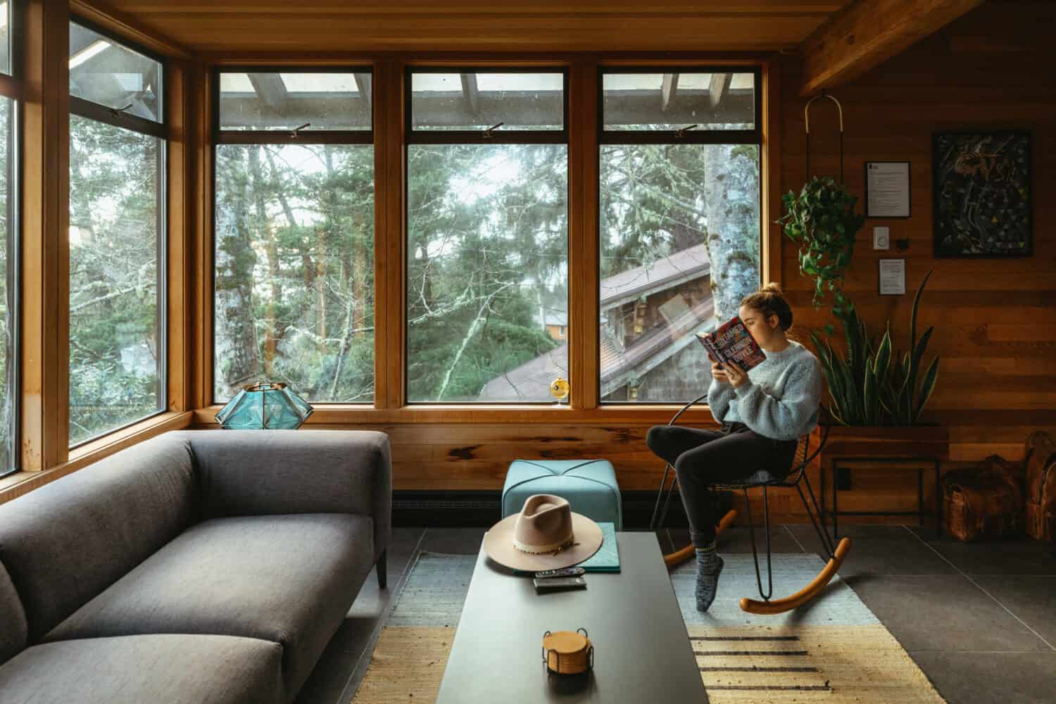 Emily Mandagie sitting at Oregon Coast Modern in Manzanita, Oregon