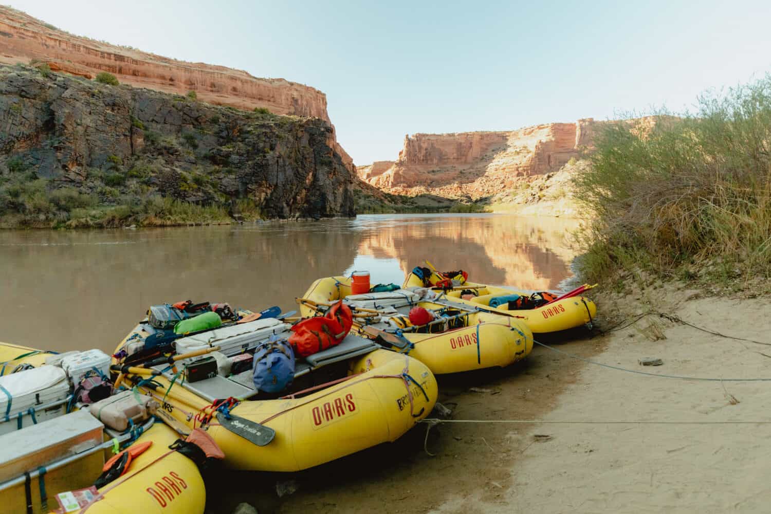 River rafting boats on Westwater Canyon during sunset