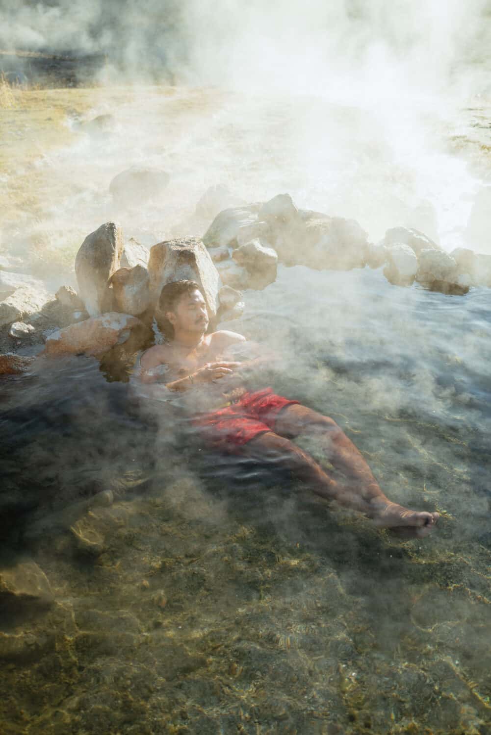 Berty Mandagie soaking in an Idaho hot spring