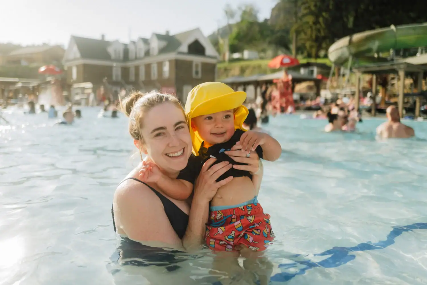 Emily Mandagie playing in the water with her toddler at Heise Hot Springs in Idaho Falls