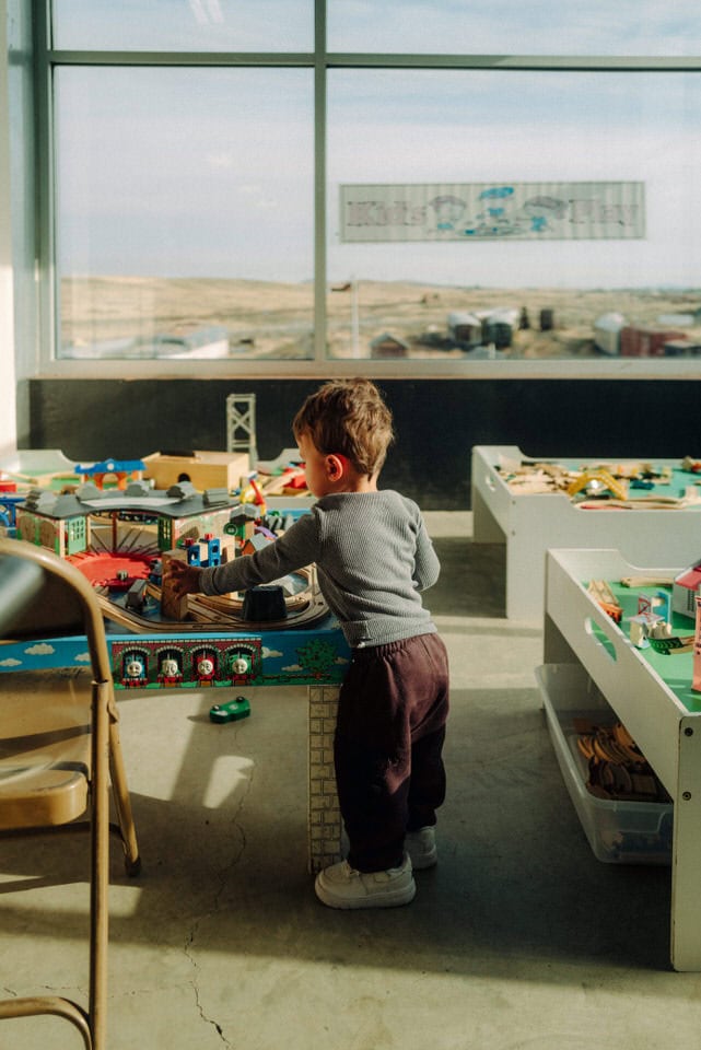 Toddler playing in the children's toy train section of the Inland NW Rail Museum in Davenport, WA