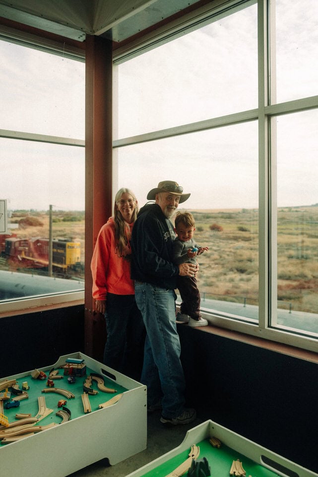 Grandparents and grandson enjoying the view outside of the Inland Northwest Rail Museum windows in Davenport, Washington